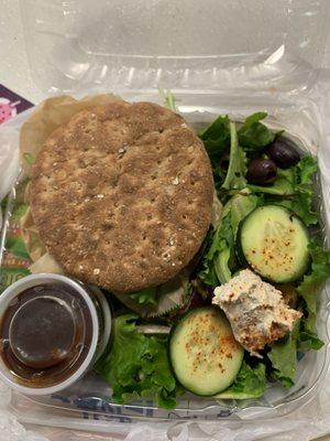 Lentil burger w/green salad topped with whipped vegan cheese