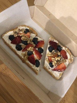 Cinnamon Ricotta toast with strawberries, blueberries, walnuts and honey drizzle