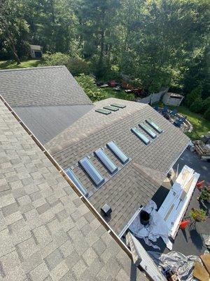 10 Mew Velux Skylights, new Shingle installation, Along with 2 square of black granulated torch down Rubber