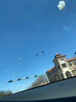 driving on the highway and someone threw something out their window and it got this small circular thing