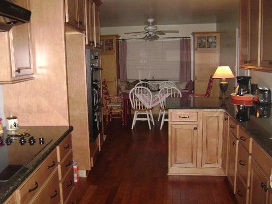 Thomasville Value Line Cabinets, Genesa door style, maple stain with carob color glaze, ubatuba granite