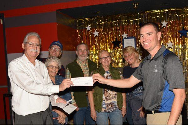 Presentation of 2019  Kiwanis Special Olympics Trout Fishing Derby check in the amount of $8,100 at the Special Olympics bowling event