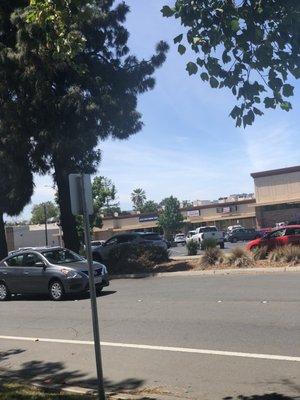 Shops near Grocery Outlet. Skinny parking lot.