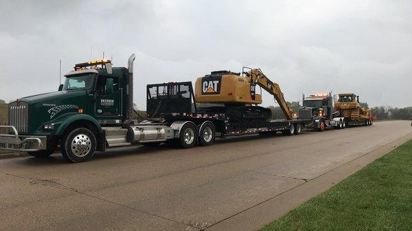 Semi hauling construction equipment