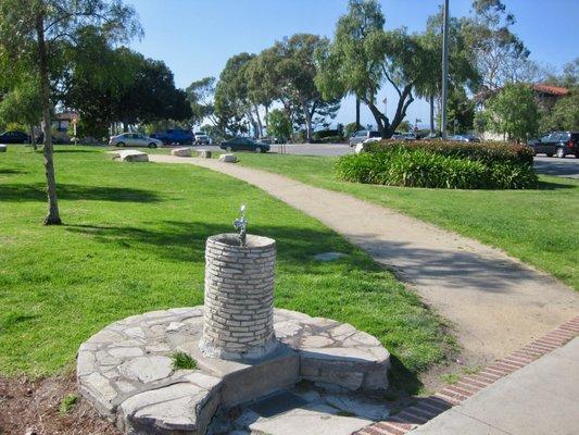 In the background is the ocean, a short distance downhill.