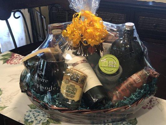 Basket Butler gift basket with meats, cheeses, wine, whiskey, chocolate, coffee mug, wine glass, crackers, and more!