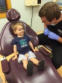 Our happy little patient with your Waverly dentist Dr. Smiley