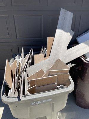 3 full trashcans of wasted flooring - they didn't compensate us, say sorry, or even come back to fix the messed up job that they did.