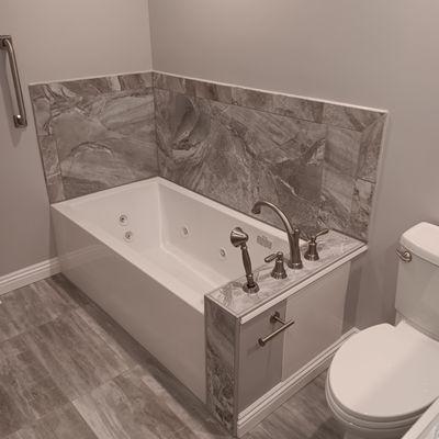 Residential Bath Remodel: Schluter Sytems, large format porcelain tiles (2'x4'), framing, plumbing, electrical, drywall, and painting