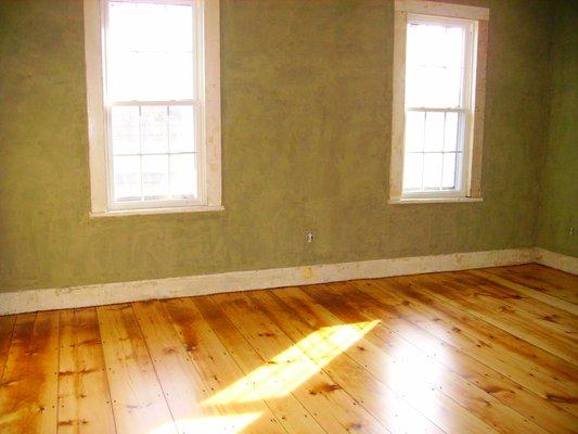 Restored plaster walls and refinished pine floors,circa 1830s.