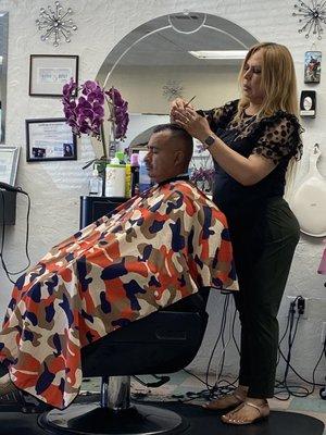 My husband getting his haircut