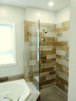 One custom shower glass installed with hardware. This customer only wanted the one piece design to keep an open feel.