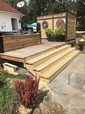 Deck with hot tub surround and privacy wall.