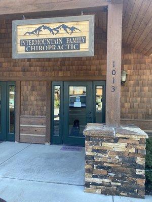 Front entrance. Bonus, the office dog, Ayla, waiting to greet new arrivals!