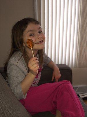 She loves her honey lollipop from Bee Charmed Gift Shop!