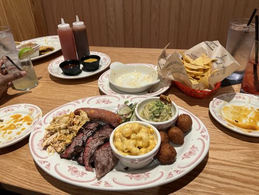 Well fed platter. Brisket, sausage, and in the left bbq chicken.