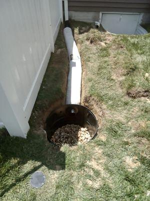 The rain water was not dispersing, and was running across the driveway.