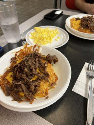 Cheesesteak Melt Hashbrown Bowl with scramble egg on the side