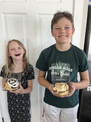 My kids with an Oreo roll and a cinnamon cream cheese roll