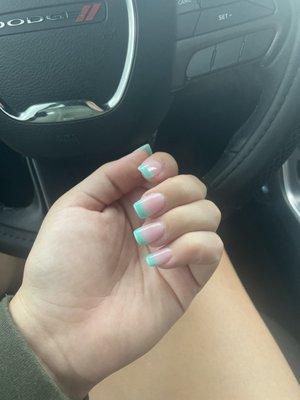 ANC dip set with tips. French manicure style with teal instead of white.