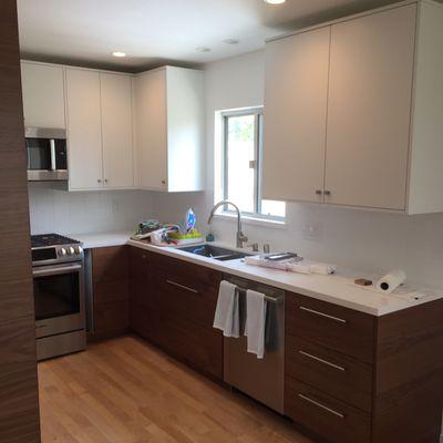 Quartz countertop and tile backsplash