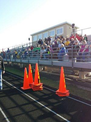 It's a multi use field,  track and field , football with spectator bleachers elevated on both long sides