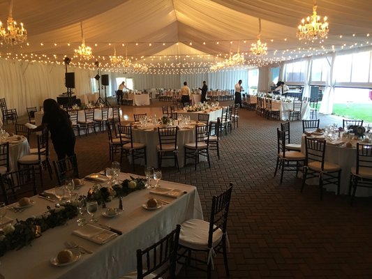 Beautiful wedding tent! String lights paired with crystal and chrome chandalier's. Call to customize your next tent rental !(916)383-1828