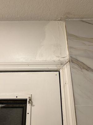 They didn't carry the tile over the corner like it was originally and left my door frame looking terrible and wall in need of repair.