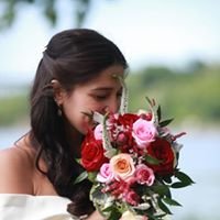 Bride cascading bouquet of reds and shades of pink