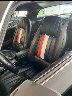 Front seats. Bob reupholstered adding the red, white and blue stripes with silver buttons. Back seats and carpet done also.