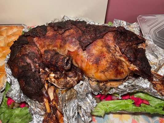 Lamb stuffed with rice, peas, raisins, and walnuts