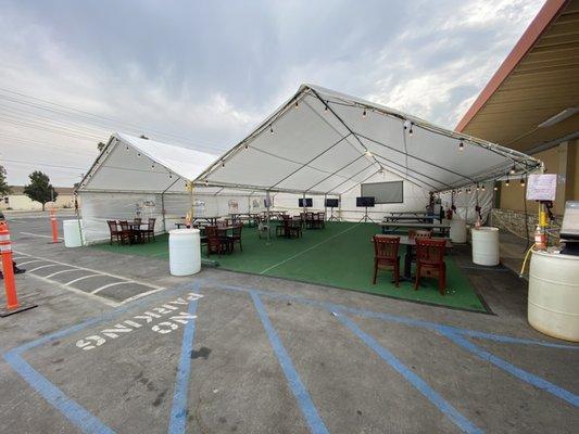 Outdoor dining with televisions