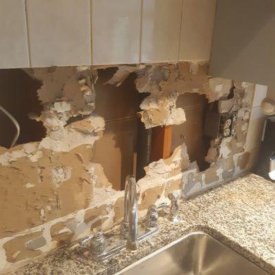 Removed kit backsplash water damaged sheetrock