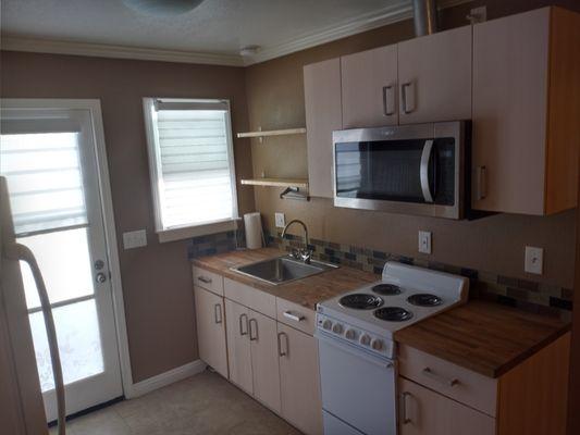 This project was a full new (mini) kitchen for our client. (Cabinetry, counters, appliances only)