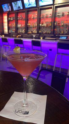 Cosmopolitan cocktail with bar background