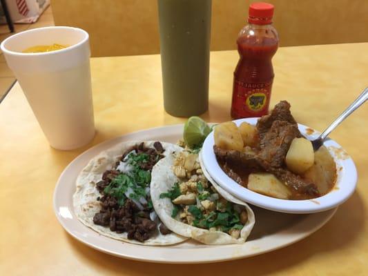 Tacos with a side of steak and potatoes. Home made fruit drinks with re refills as well