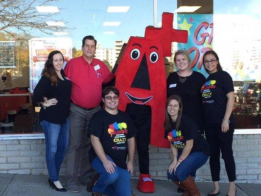 Our staff and A+ mascot at our Grand Opening.