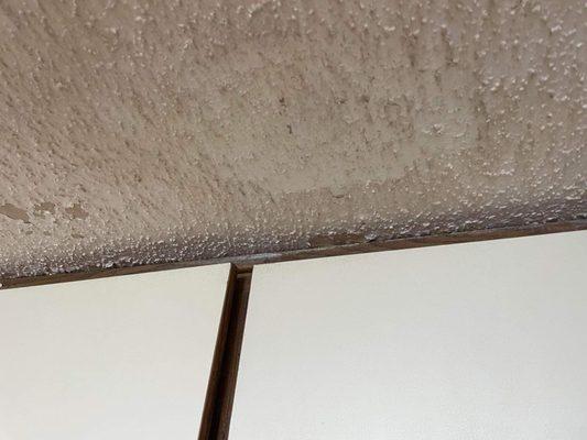 Popcorn ceiling and condensation don't mix. Sent pics