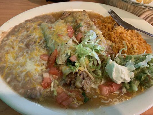 Excellent pork enchilada and chile relleno with beans and rice. I stole the guacamole and crema from my husbands plate.