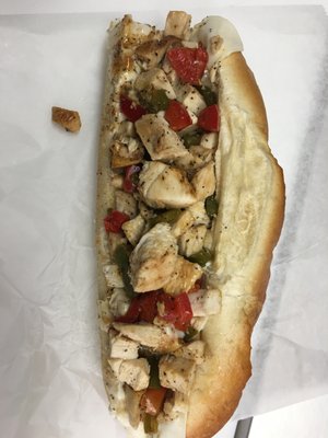 Chicken cheesesteak with onions, papers and tomatoes