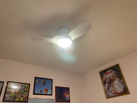 Wired ceiling fan in bedroom