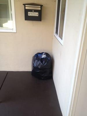 Trash left in the common areas of Central Apartments.