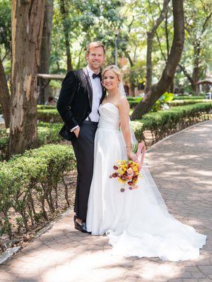 Bride and groom in the tropical Parque de Mexico, Mexico City.