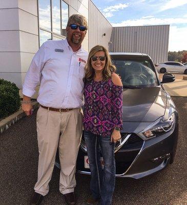 Amanda Gulledge with her new 2017 Nissan Maxima! With her sales person Brett Hobson.