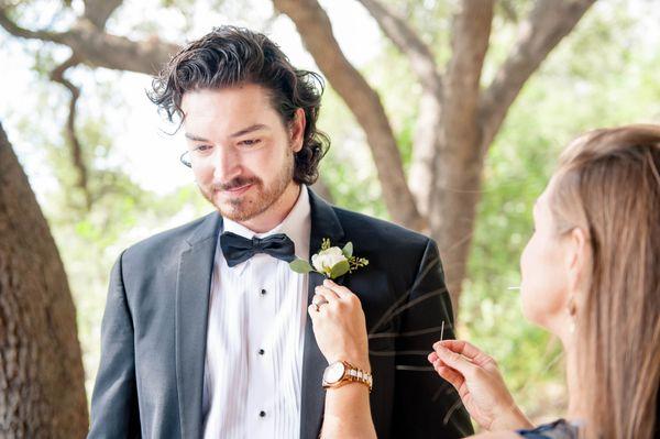 Lindsey is such a go-getter. She kept our entire wedding day together. Her she is pinning on the guy's boutonnieres.