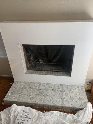 Brick Fireplace remodel with Italian marble tiling