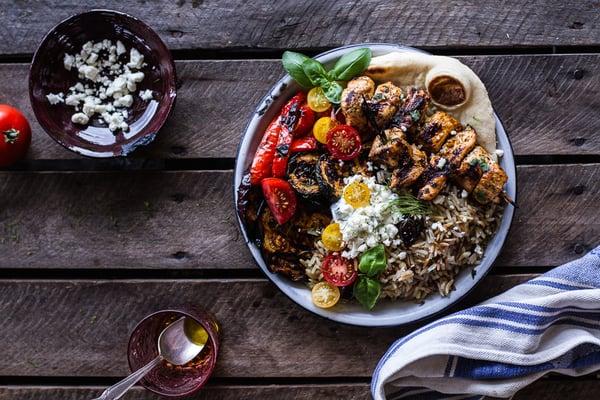 Greek Chicken Souvlaki and Rice-Pilaf-Plates-w-Marinated-Veggies-+-Feta-Tzatziki