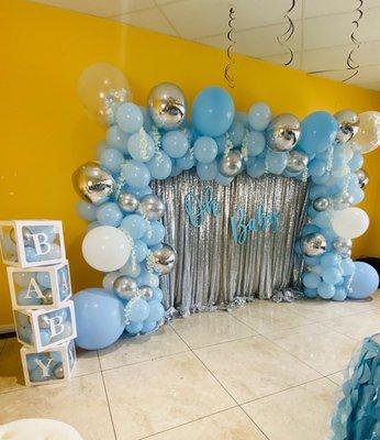 Sequin wall with full balloon garland and balloon boxes