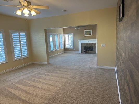 New carpet and baseboard. Excellent detail around fireplaces.