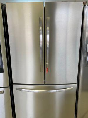 Frigidaire French door Refrigerator with ice and water. The water dispenser is inside the unit.